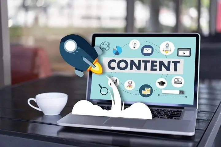 Laptop showing a content strategy concept with marketing illustrations
